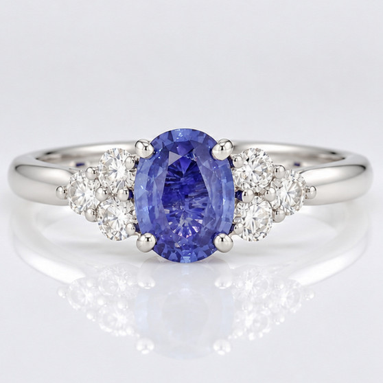 Platinum oval cut Ceylon sapphire and round brilliant cut diamond ring
