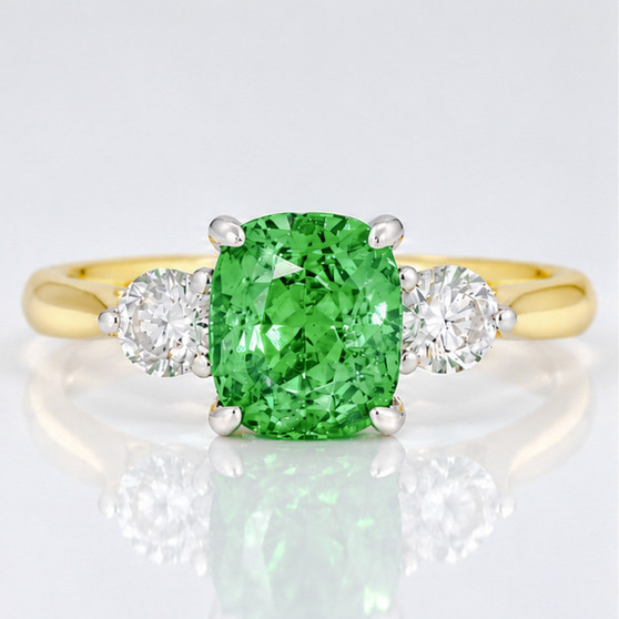 18ct and platinum cushion cut tsavorite garnet and round brilliant cut diamond ring
