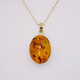9ct gold oval cabochon cut amber pendant