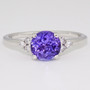 18ct white gold round cut tanzanite and round brilliant cut diamond ring