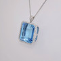 9ct white gold emerald cut blue topaz and diamond cluster pendant PE4620 - side