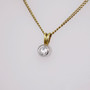 18ct gold diamond solitaire pendant with rubover setting side