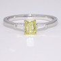 18ct white gold fancy intense yellow cushion cut diamond and tapered baguette diamond ring