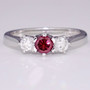 18ct white gold diamond trilogy ring with treated fancy vivid purplish pink centre diamond