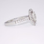 Platinum pear cut diamond halo ring with diamond-set shoulders side