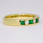 18ct yellow gold emerald and diamond eternity ring side