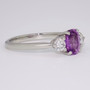 Platinum oval cut purple sapphire and diamond ring side