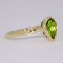 9ct gold fancy pear cut peridot rubover ring side