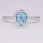 9ct white gold fancy pear cut blue topaz rubover ring