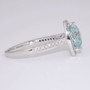 Platinum trillion cut aquamarine and diamond cluster ring with diamond-set shoulders side