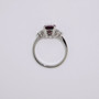 Platinum scissor cut raspberry garnet and round brilliant cut diamond ring top