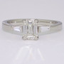 Platinum emerald cut and tapered baguette cut diamond ring