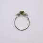 Platinum cushion cut green tourmaline and round brilliant cut diamond ring top