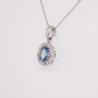 18ct white gold oval cut aquamarine and round brilliant cut diamond cluster pendant side