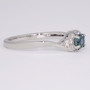 Platinum round cut teal Montana sapphire and diamond cluster twist ring side