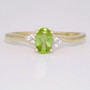 9ct gold oval cut peridot and diamond twist ring