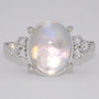 18ct white gold oval cabochon cut rainbow moonstone and round brilliant cut diamond ring