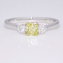 18ct white and yellow gold fancy intense yellow cushion cut diamond trilogy ring