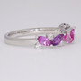 Platinum marquise cut purple, pink and blue sapphire and round brilliant cut diamond ring side