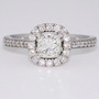 Platinum princess cut diamond ring with round brilliant cut diamond halo and diamond-set shoulders