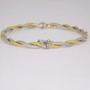 9ct yellow and white gold textured hinged twisted bangle clasp