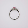 Platinum round cut unheated padparadscha sapphire and diamond ring top