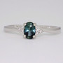 Platinum teal sapphire and diamond twist ring