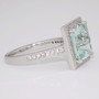 Unique platinum radiant cut unheated aquamarine and diamond halo ring side