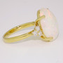 18ct gold cabochon cut Ethiopian opal and round brilliant cut diamond ring side