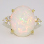 18ct gold cabochon cut Ethiopian opal and round brilliant cut diamond ring