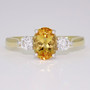 18ct gold oval cut Imperial topaz and round brilliant cut diamond ring