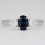 Platinum oval cut teal sapphire and pear cut diamond ring