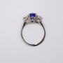 Platinum radiant cut sapphire and round brilliant cut diamond ring top