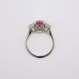 Platinum certificated unheated oval cut padparadscha sapphire and round brilliant cut diamond ring top