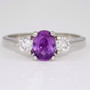 Platinum unheated oval cut purple sapphire and diamond ring