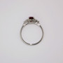 Platinum oval cut ruby and round brilliant cut diamond ring top