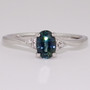 9ct white gold oval cut teal sapphire and round brilliant cut diamond twist ring