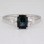 Platinum ring with unheated emerald cut Australian teal sapphire and six round brilliant cut diamonds