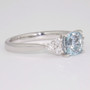 Platinum cushion cut Brazilian aquamarine and six round brilliant cut diamond ring side