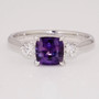 Platinum cushion cut purple sapphire and round brilliant cut diamond ring