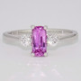 Unique platinum elongated cushion cut pink sapphire and round brilliant cut diamond ring