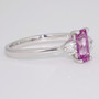 Unique platinum elongated cushion cut pink sapphire and round brilliant cut diamond ring side