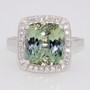 Platinum rectangular cushion cut green tanzanite and round brilliant cut diamond cluster ring