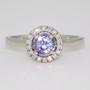 Platinum round cut Ceylon sapphire and diamond halo ring