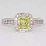 18ct white gold certificated fancy intense yellow cushion cut diamond halo ring with diamond-set shoulders