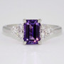 Platinum octagonal cut purple sapphire and six round brilliant cut diamond ring