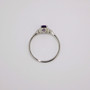 9ct white gold ring with oval cut amethyst and diamond-set V-shaped shoulders top