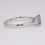 Platinum unheated oval cut Ceylon sapphire and round brilliant cut diamond ring side