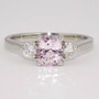 Platinum unheated cushion cut pastel pink sapphire and round brilliant cut diamond ring