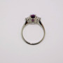 Platinum oval cut deep pink sapphire and round brilliant cut diamond ring top